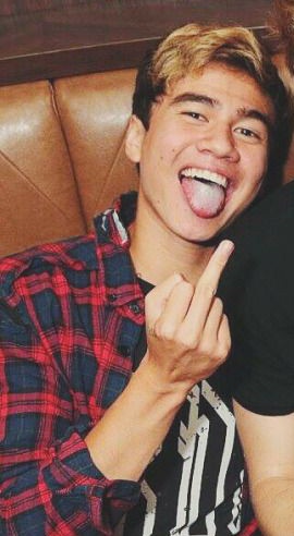 a thread of calum with his tongue out