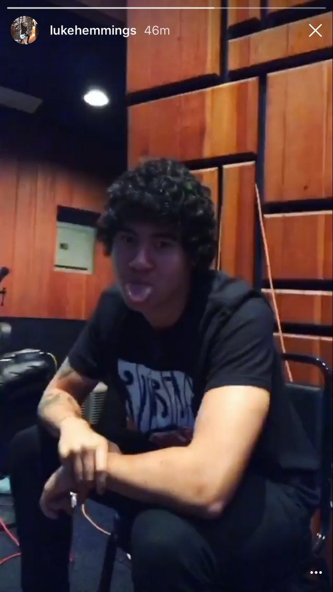 a thread of calum with his tongue out