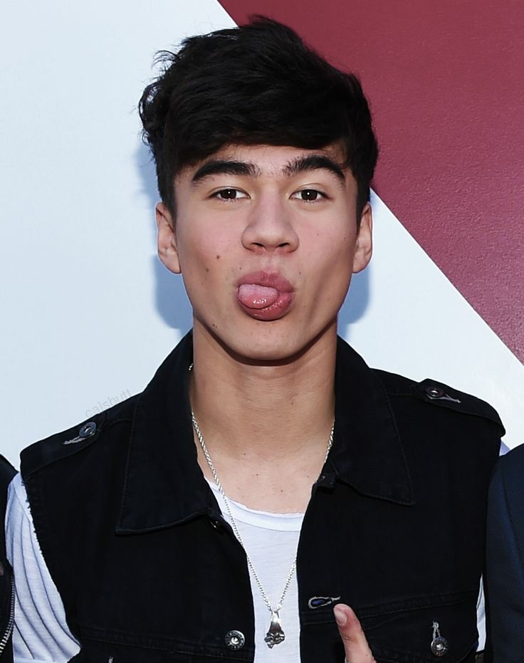 a thread of calum with his tongue out