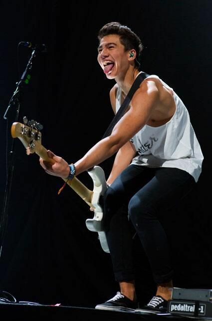 a thread of calum with his tongue out