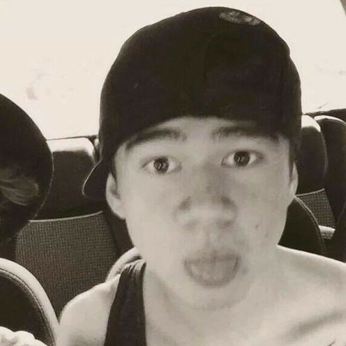 a thread of calum with his tongue out
