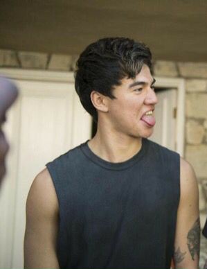 a thread of calum with his tongue out