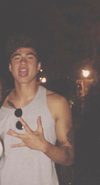 a thread of calum with his tongue out