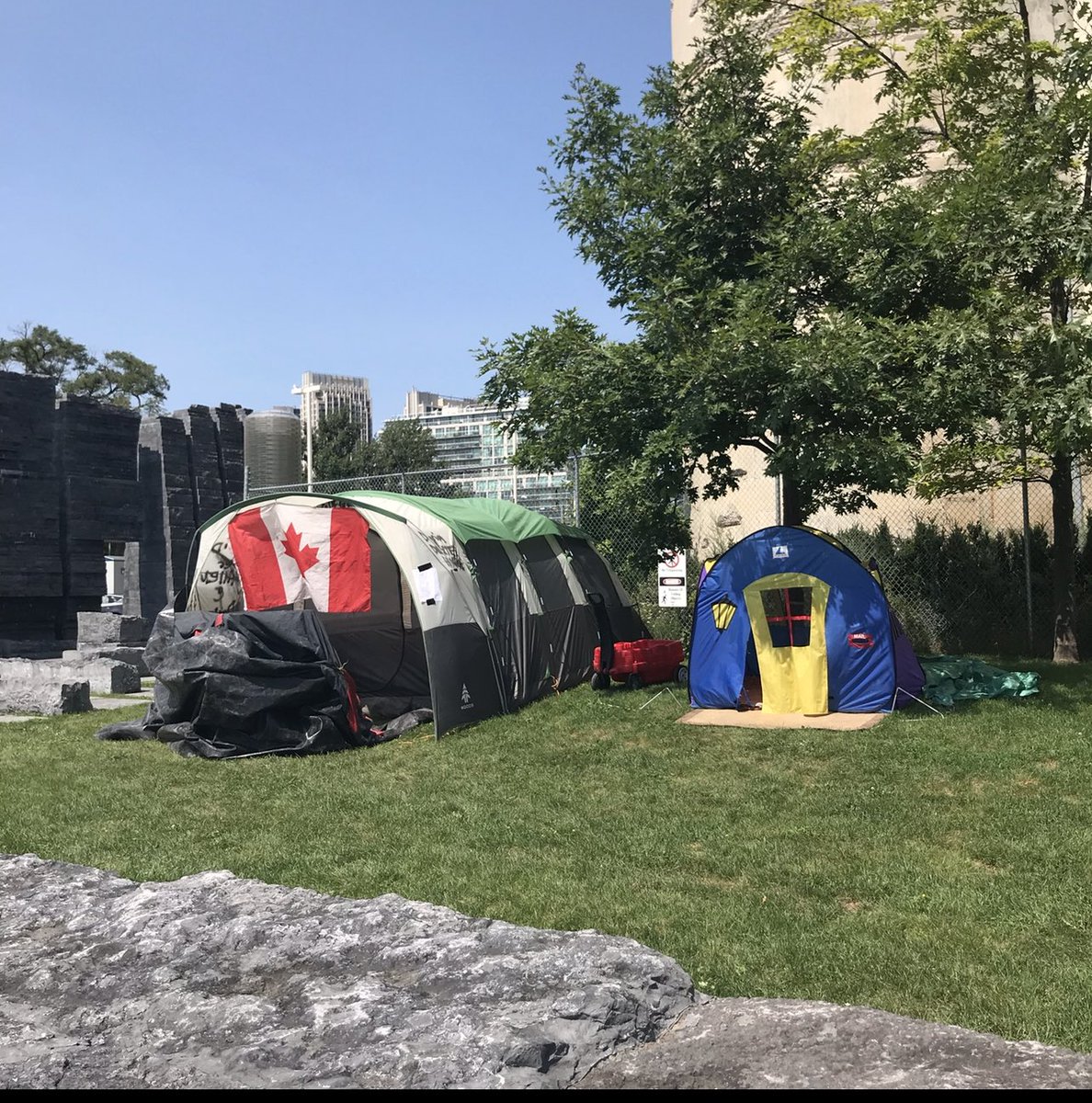 what more do we need to say than this? a homeless camp was cleared from Eirann Quay to make way for the ... refugee memorial. one former resident went to another camp and - tw self violence - lit himself on fire recently, intentionally, out of frustration. he's ok now.  #toronto