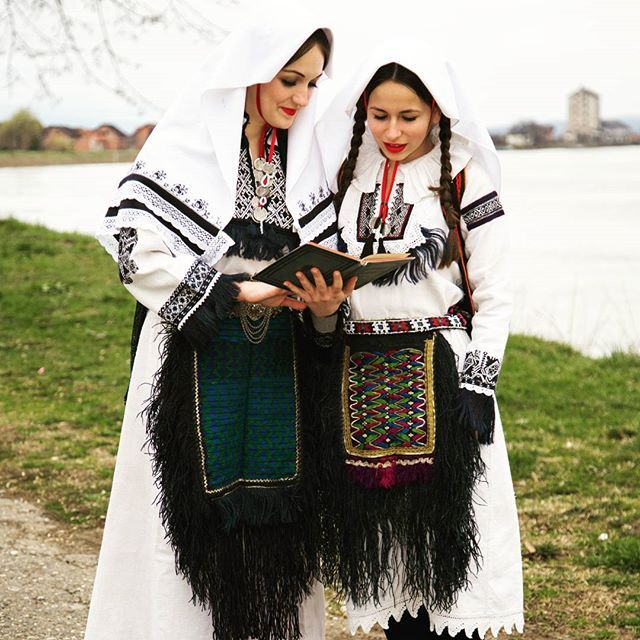 The head covering is the bošča, rich embroidery and a decorative cloth applique strip, called the mavez. For young married women, the mavez was bright red. Bošča might continue to be worn as long as they were raising young children. Older women, the mavez is dark blue instead.
