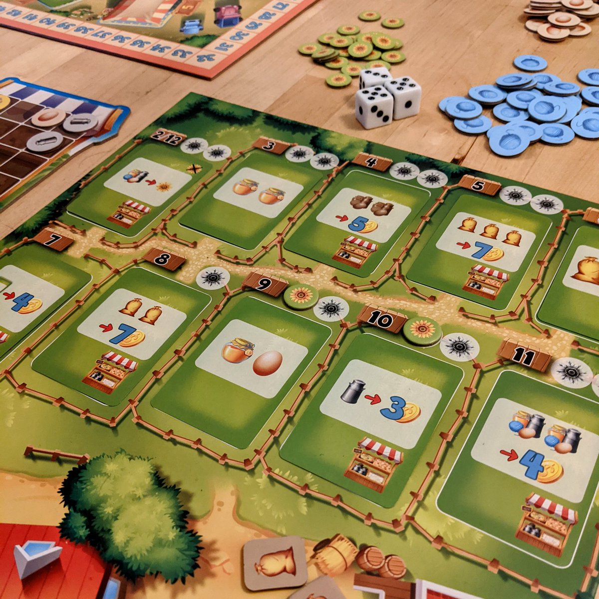 Playing some My Farm Shop, the new Rüdiger Dorn game from <a href="/pegasusspiele/">Pegasus Spiele</a>. It's s very nice twist on the Machi Koro formula, with more choices to make each round with 3 dice, 1 of which dictates what upgrade you get. Also multiple small expansion to add to the simple base game 🙂