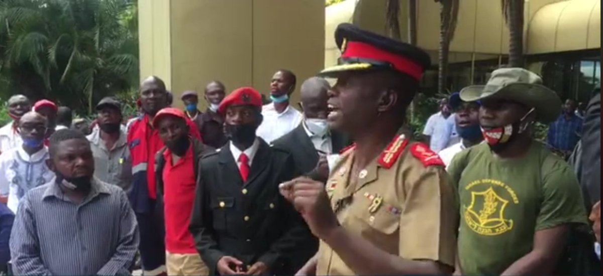 As chaotic scenes spiral out of control during the MDC-T congress, youth leader Shakespeare Mukoyi, donning a military uniform replica, takes to the podium and threatens to unleash the youths on unruly members. He orders everyone to leave the high table, except the candidates.