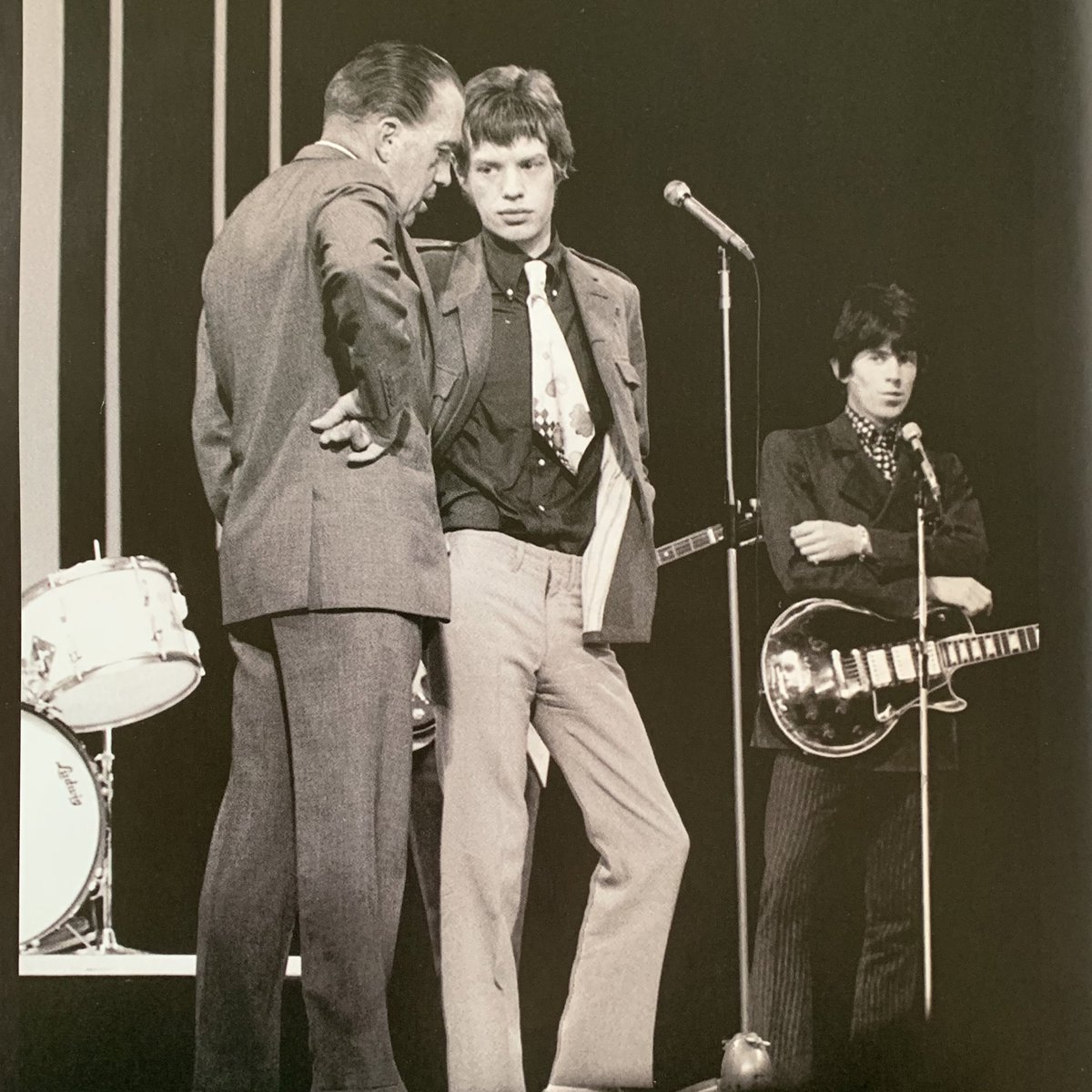 both bands played on the Ed Sullivan show but Ed liked the stones better and taught mick his signature stick out your elbow move. all the beatles got were arrows pointing at the floor and orange rectangles
