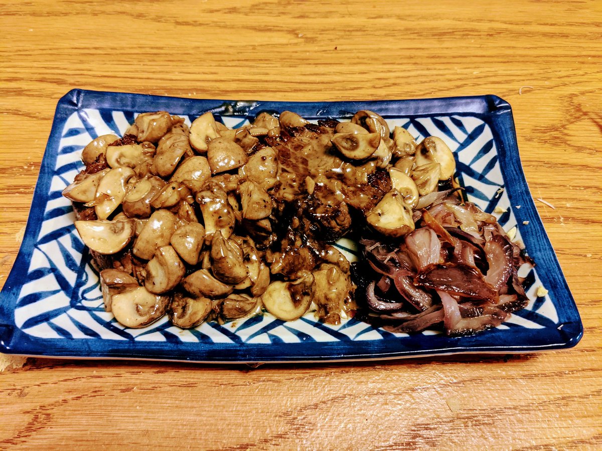 Beef tenderloin with cream mushroom pan sauce & sauteed red onions