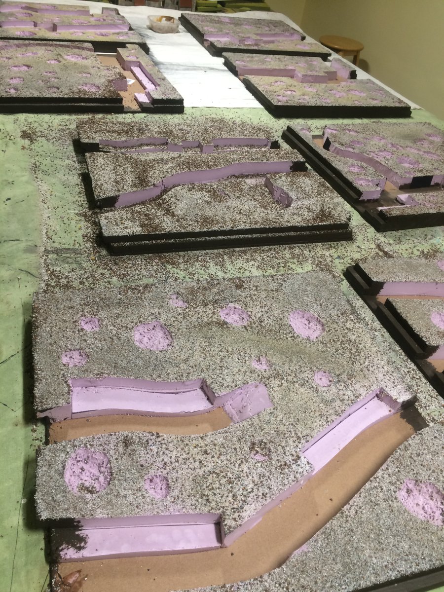 I good friend of mine helped me at this stage, using hos gaming table. We painted the edges and I reinforfced the corners with hockey tape. (How Canadian). Then white glue and mixed large and small pieces of sand.