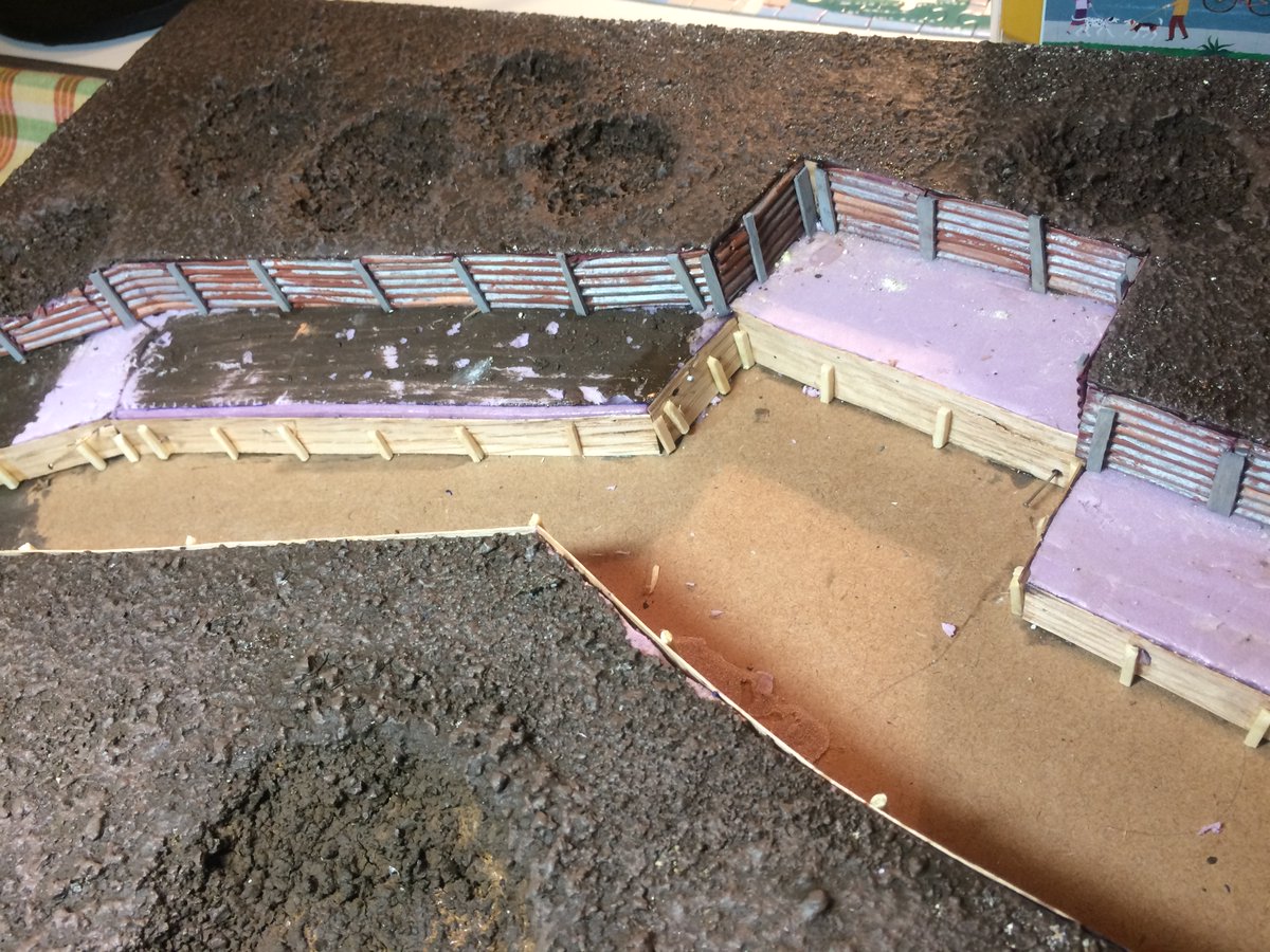 Bamboo mat as duckboards, I know it's not really what they look like but tie was running out. I also used coffee stir stick in places. I cut matchsticks to be used as posts holding up the trench walls. There were several coats of drybrush lighter colored brown paint applied.