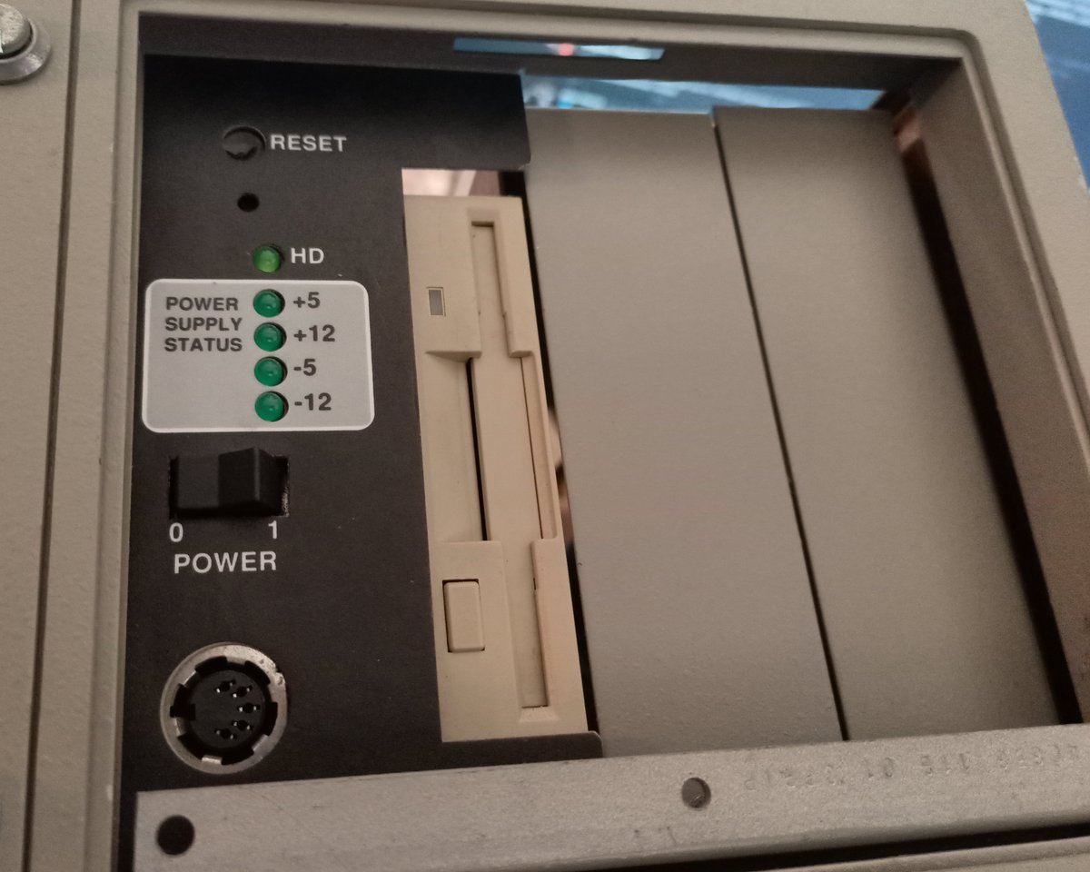 It's got an interesting front panel. You've got the floppy drive, a reset button, power switch, and separate LEDs for each of the power supply rails! Handy.It's also got a floppy drive connector (AT type), which is rare to have on the front, especially since...