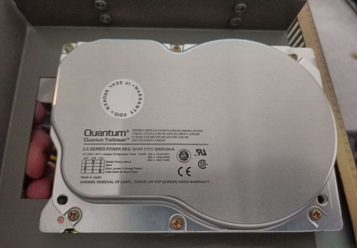 The hard drive is a surprisingly clean Quantum Trailblazer.It's an 840AT (though you can't tell from the top), which is an 840mb drive.