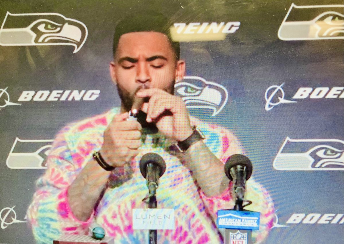 Jamal Adams lighting up a victory cigar at the end of his presser.