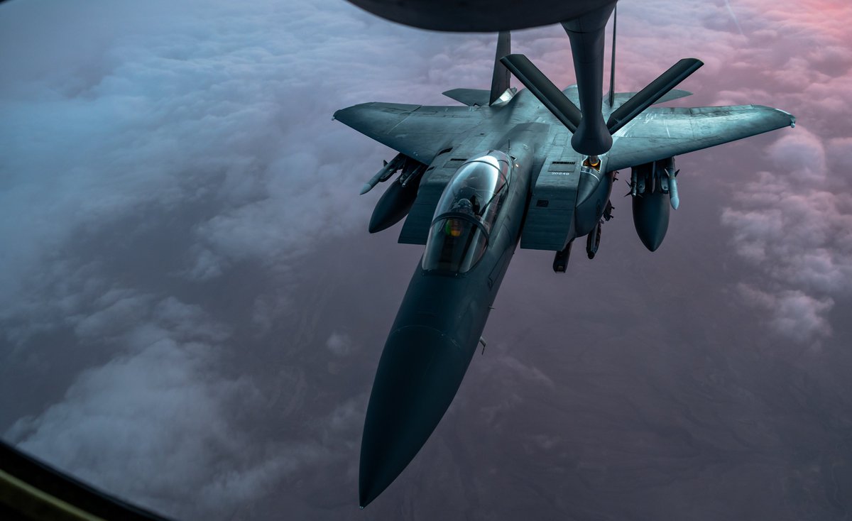 A U.S. Air Force F-15E Strike Eagle receives fuel from a U.S. Air Force KC-135 Stratotanker, assigned to the 50th Expeditionary Aircraft Refueling Squadron, during an air refueling mission over Southwest Asia, Dec. 22, 2020.