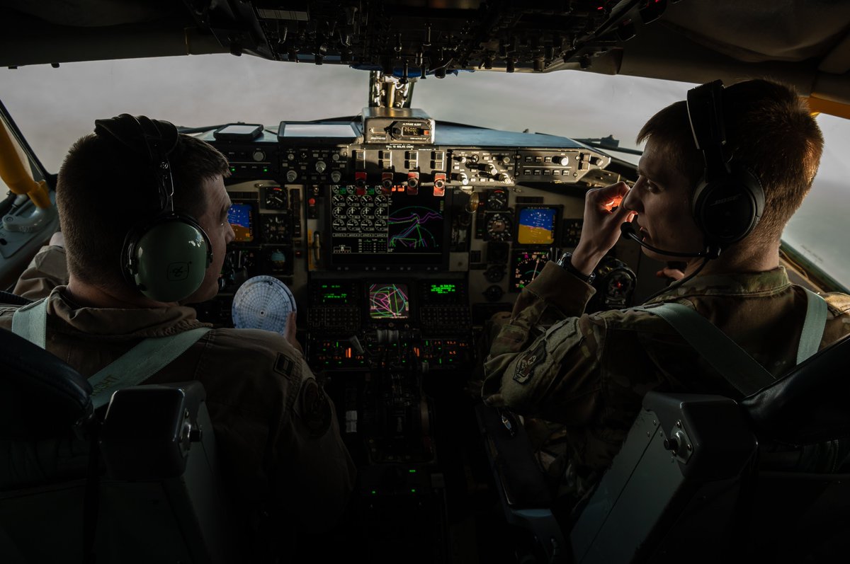 Two U.S. Air Force KC-135 Stratotanker pilots, assigned to the 340th Expeditionary Aircraft Refueling Squadron, control the aircraft during an air refueling mission over Southwest Asia, Dec. 22, 2020.