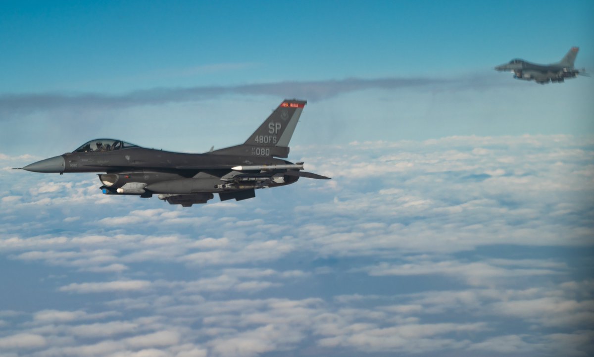 Two U.S. Air Force F-16 Fighting Falcons fly alongside a U.S. Air Force KC-135 Stratotanker, assigned to the 50th Expeditionary Aircraft Refueling Squadron, during an air refueling mission over Southwest Asia, Dec. 22, 2020.