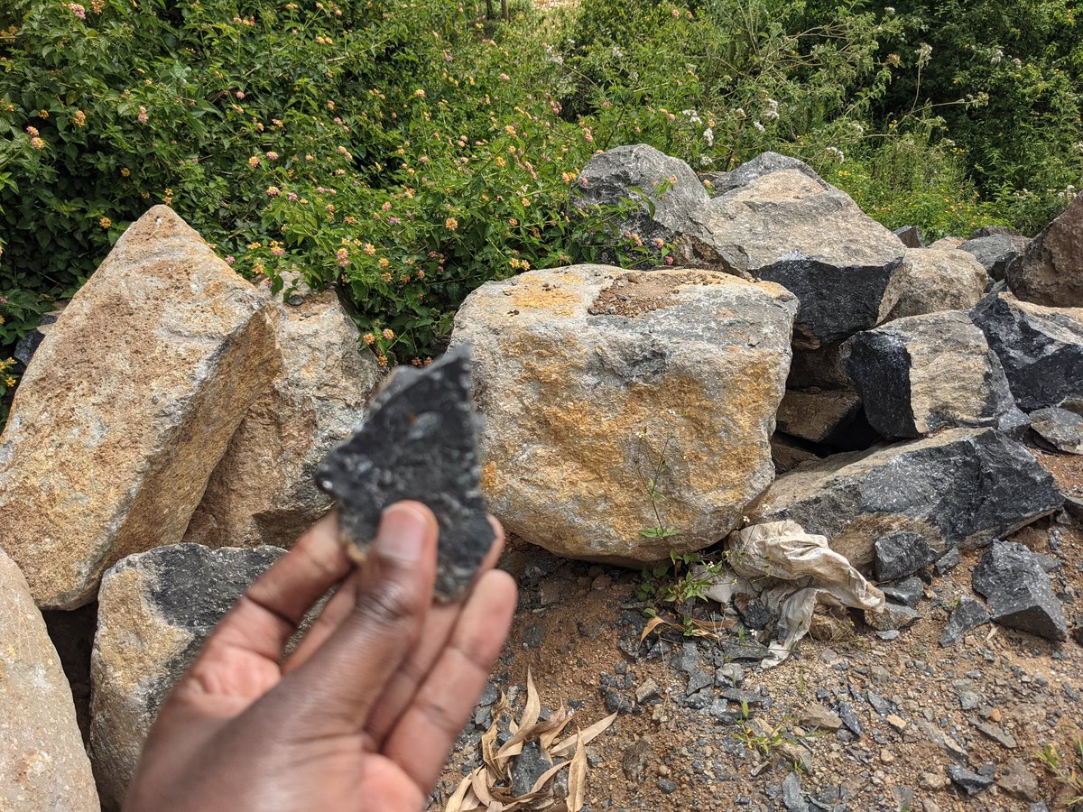 the black rock im holding is from the red rock nahuko. that's why it's important to have a fresh sample using a rock hammer.but as you can tell from our footwear that we don't have the correct tools to get a sample.