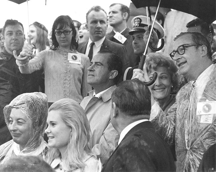 Bonus: Observers, among them President Nixon, trying to stay dry while awaiting the launch.