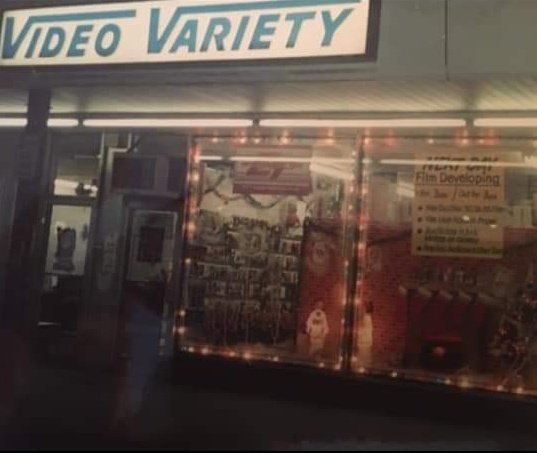 Dillon_Rochford's tweet photo. My parents at the video store they owned in the late 80s. They went out of business after larger companies like Blockbuster came along. Safe to say we were happy when Netflix and streaming returned the favor to Blockbuster 😂
#OldSchoolCool https://t.co/Q7nBUp79fY