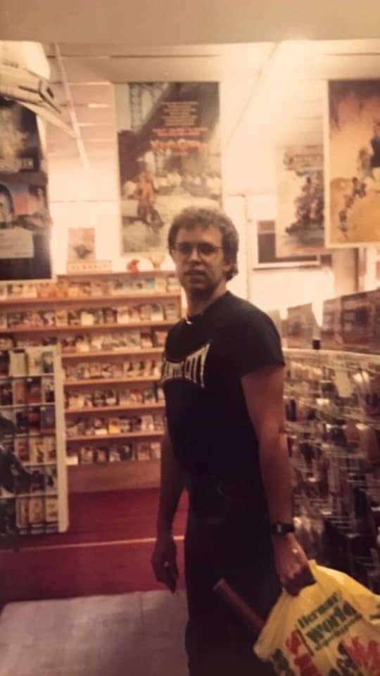 Dillon_Rochford's tweet photo. My parents at the video store they owned in the late 80s. They went out of business after larger companies like Blockbuster came along. Safe to say we were happy when Netflix and streaming returned the favor to Blockbuster 😂
#OldSchoolCool https://t.co/Q7nBUp79fY