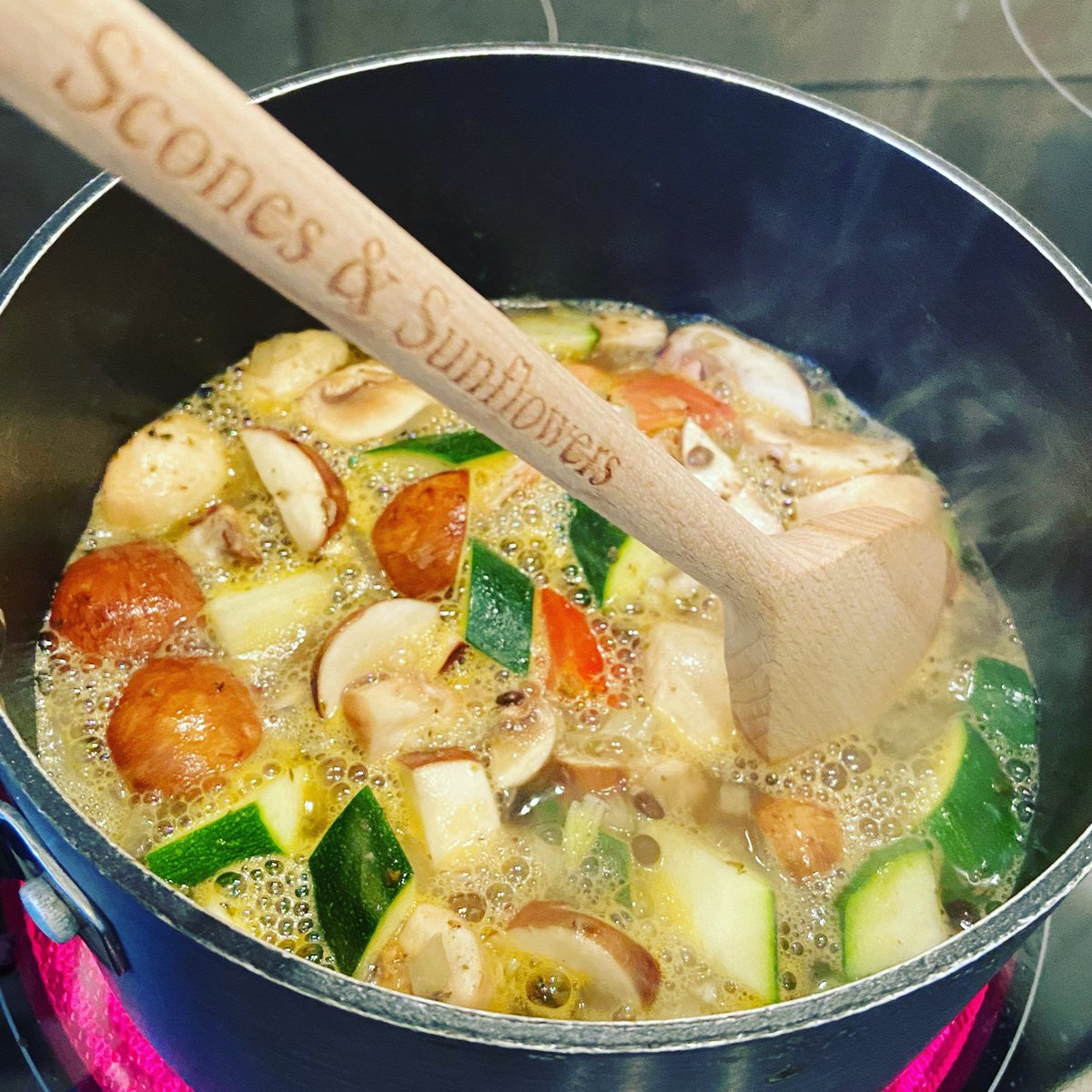 Sometimes just a big bowl of hearty vegetable and lentil soup is all you need on a cold winters day! Stirred with a bespoke wooden spoon! #homemadesoup #heartysoup #chestnutmushrooms #courgettechunks #onion #tomato #vegestock #puylentils #scones_sunflowers #thoughtfulpresent