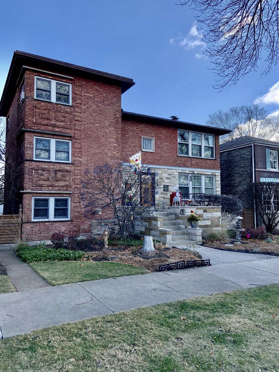 Up the block from their house is one that has Greek keys and the multi-colored limestone that you see in a lot of Carlson’s houses, but I haven’t confirmed he designed it.