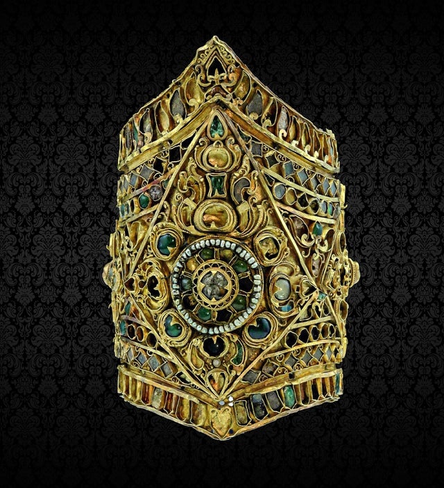 Gold bracelet encrusted with many gems. Thailand