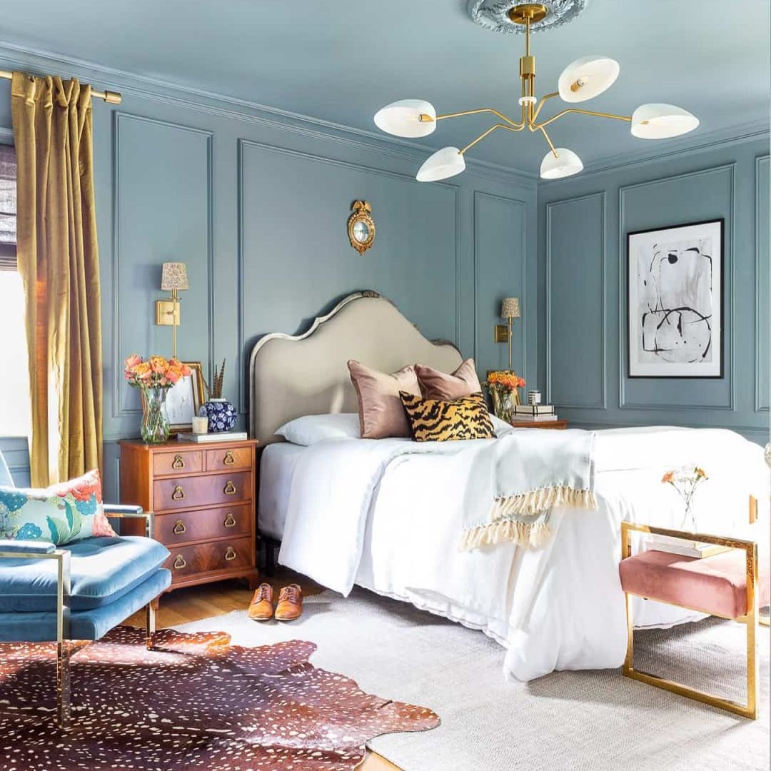 A beautiful teal paint colour is shown on a wall in a bedroom.