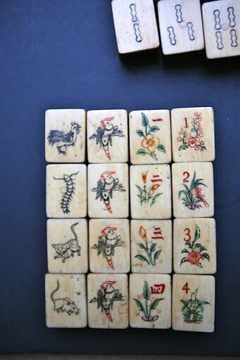 I can't say I've wholly wrapped my head around it yet but I'm loving the cat-eats-mouse chicken-eats-centipede rules around the animal tiles in the Singaporean variant of Mahjong.