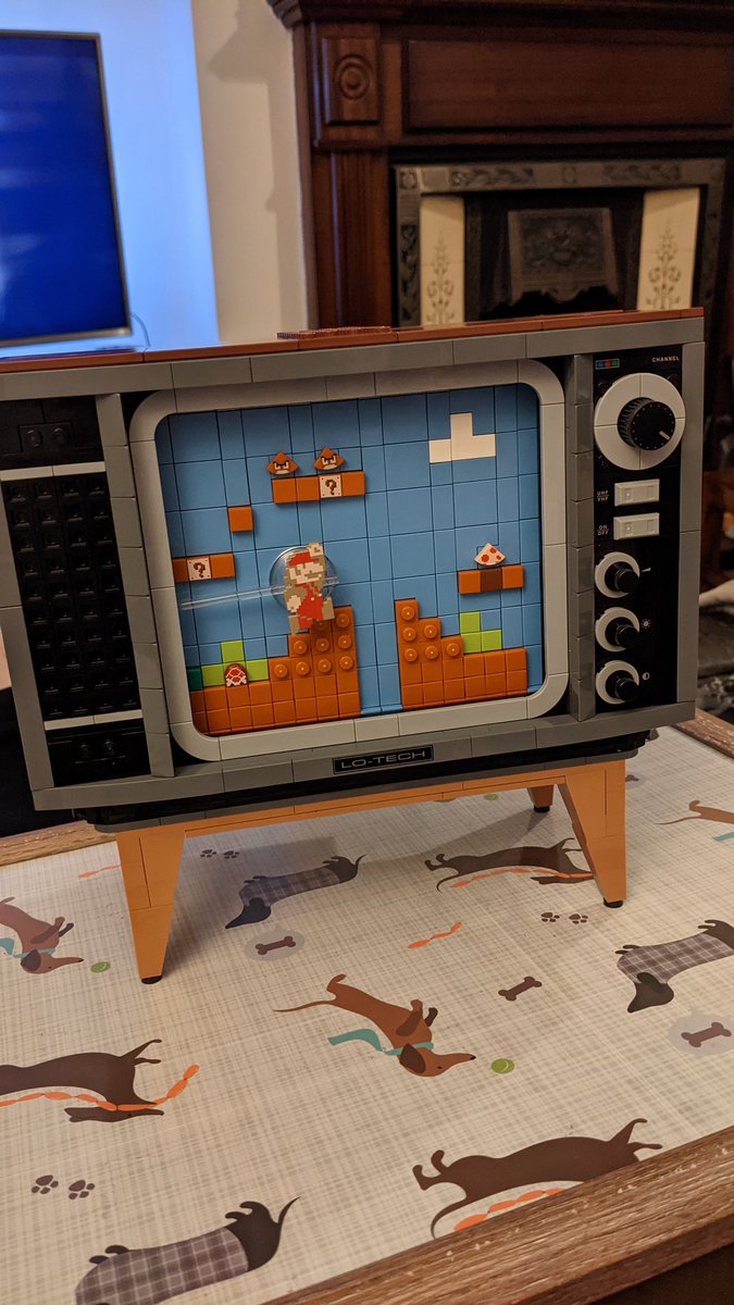 I assure you, you are not prepared for how cute this TV is. It sits on a little Lego stand! The channel button actually makes a little click when you turn it around. It is absolutely gorgeous.