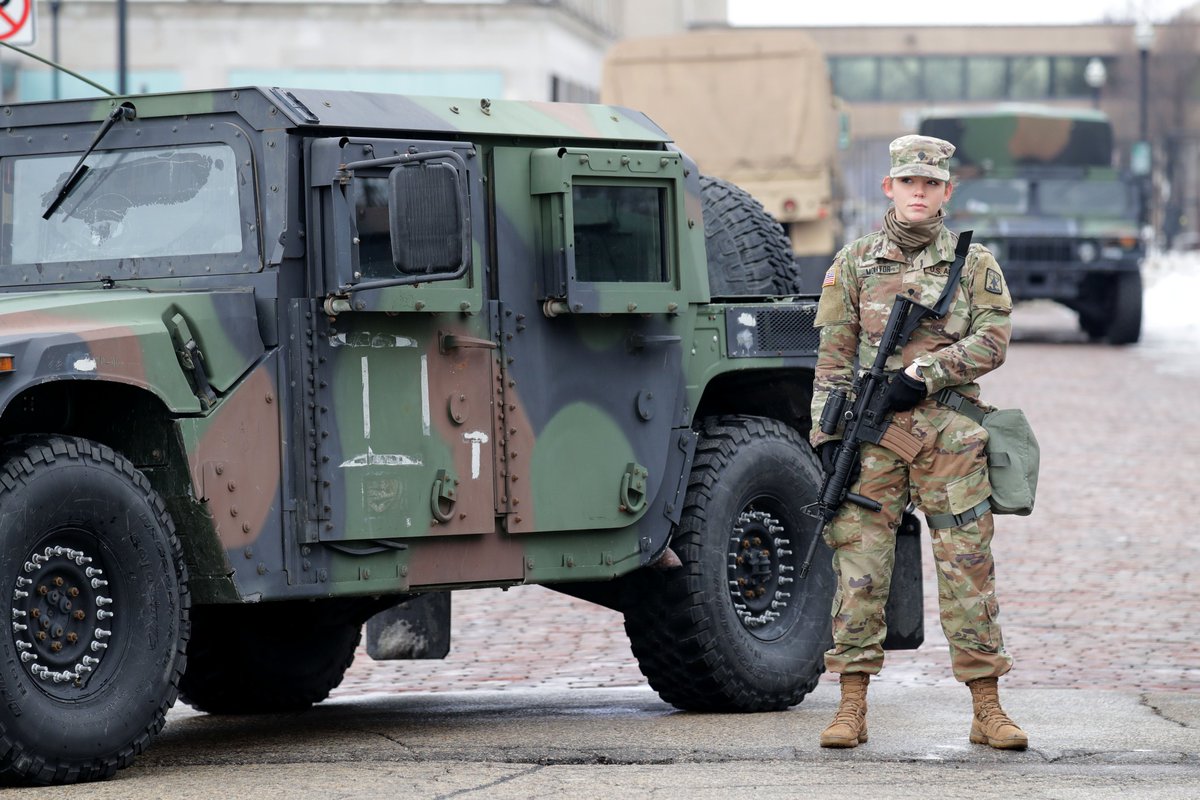 mdesisti's tweet image. More photos from the scene right now in #Kenosha near the courthouse. That first one is a Marine vet. shaking a guard's hand. #JacobBlake