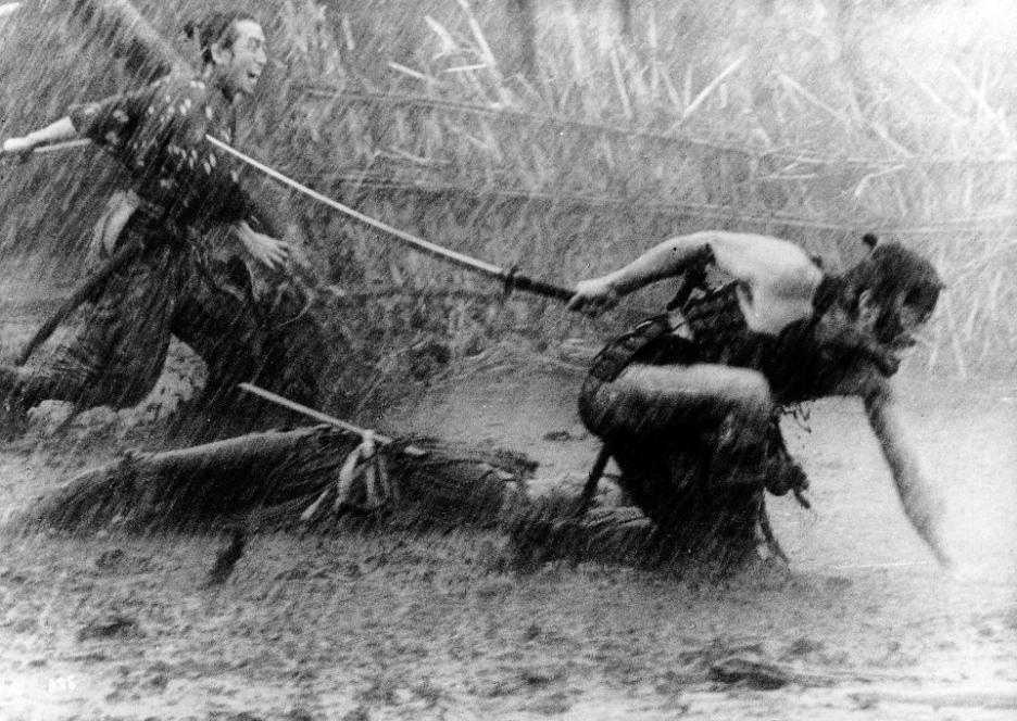 Seiji Miyaguchi and Toshirô Mifune in Akira Kurosawa's The Seven Samurai, running through hard rain into battle