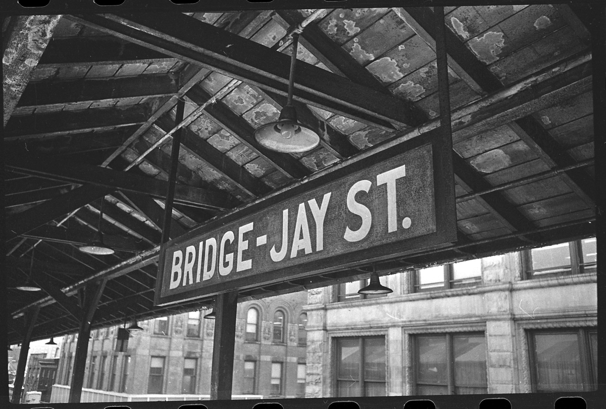 This #NYTMCollection photo shows the Myrtle Avenue Elevated’s Bridge – Jay Street station in August of 1969. Two months later, in October of 1969, the elevated line was closed due to a decline in ridership. Where can you see remnants of the original line today?