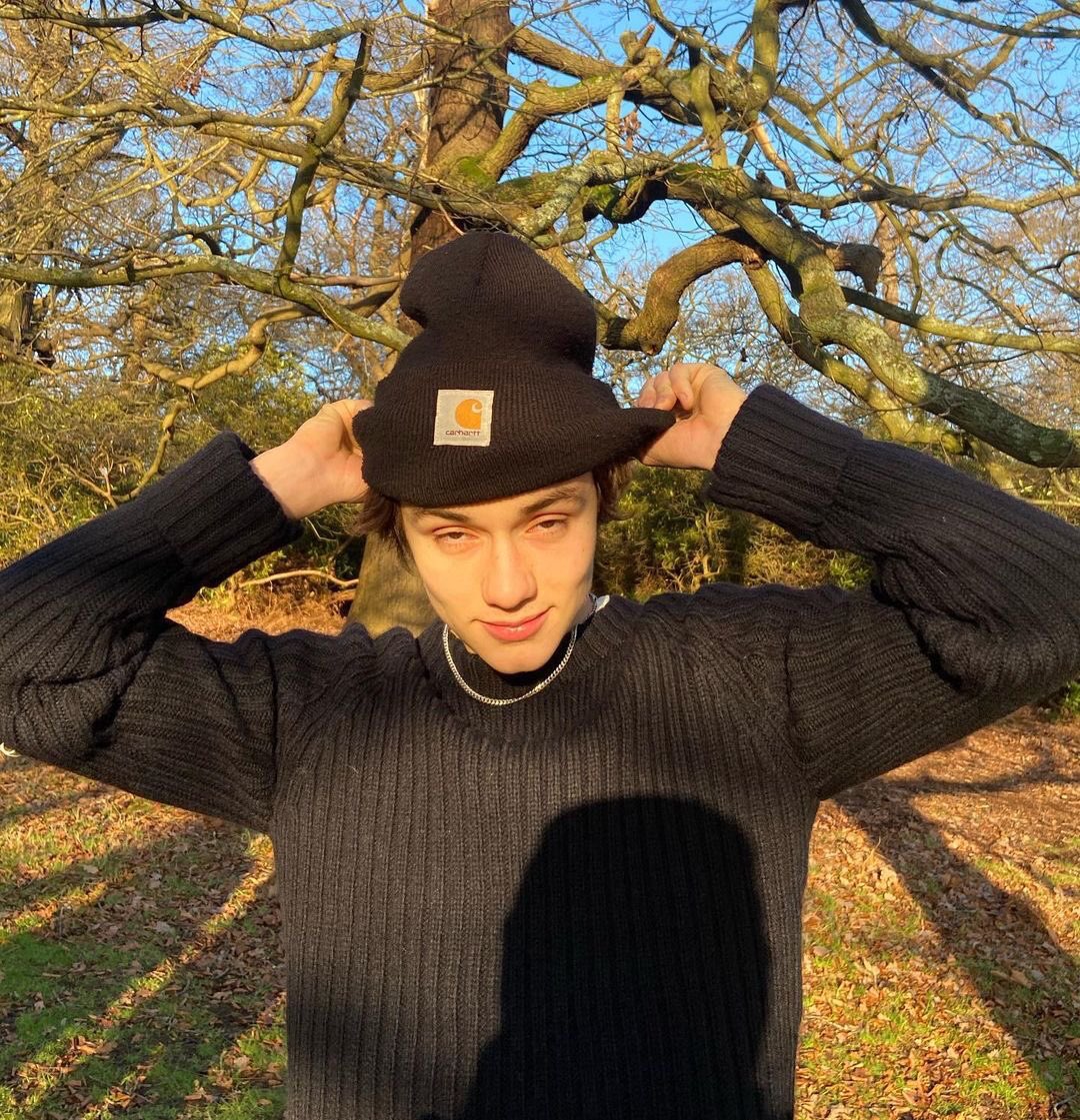 Enjoying the enormous amount of fun in my day, standing and posing for some pictures to feed the dead from last November by wearing the all black outfit with a beanie on my head. Choose your fighter, my moneys on the last one.