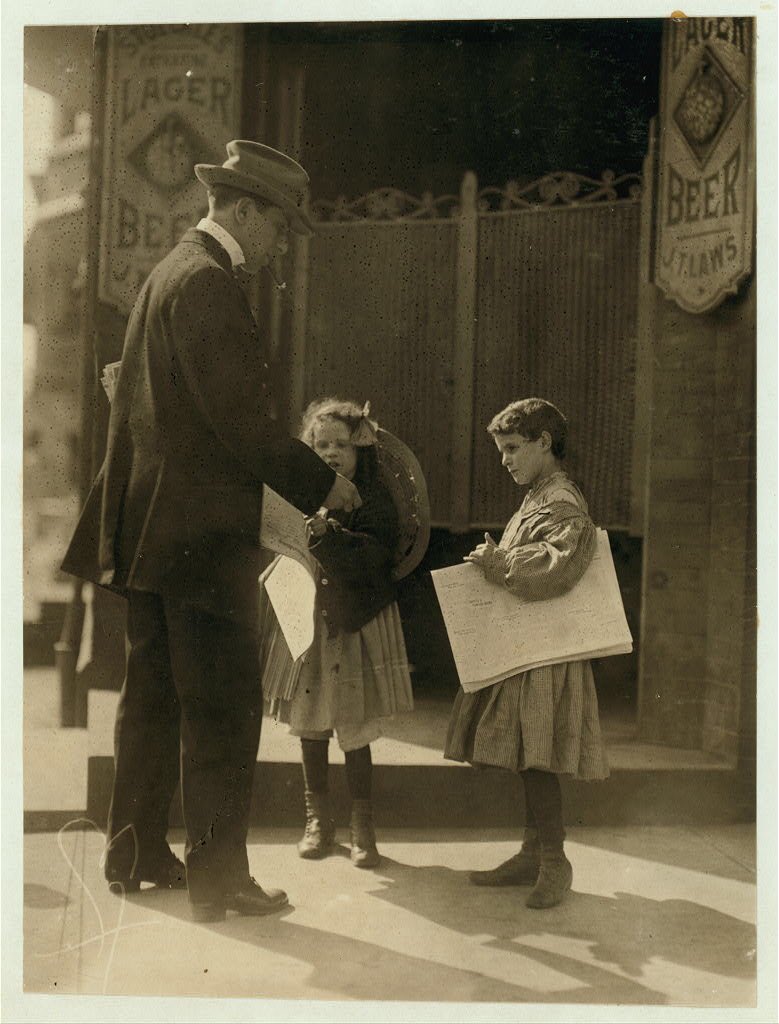 Two newsgirls. Wilmington, Del.National Child Labor Committee Photographs taken by Lewis Hine, ca. 1910