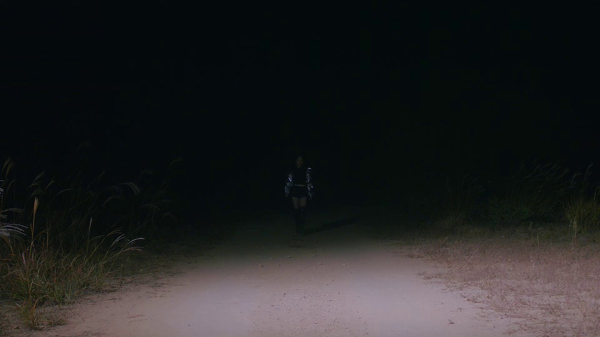 Olivia Hye from So What transitions "into" Heejin in Why Not, then the video moves to the Egoist scene where Olivia Hye is embraced by her other self but off-colored(Heejin played the role of Olivia Hye's other self there) https://post.naver.com/viewer/postView.nhn?volumeNo=14408371&memberNo=39258591