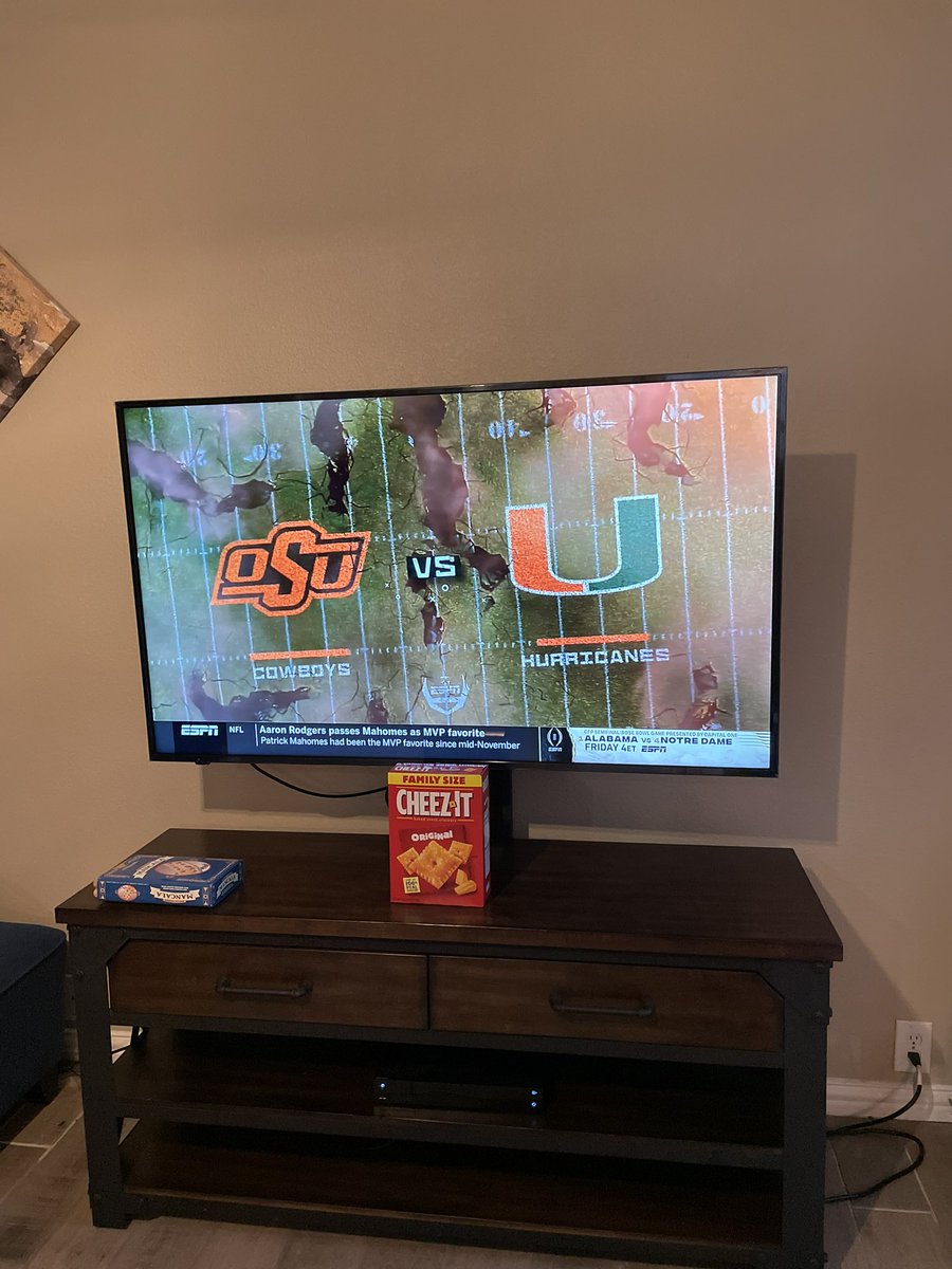 JaymeHightower's tweet photo. Watching the @CheezItBowl with a box of cheez its! How do I get a custom 2020 cheez it bowl box? @CowboyFB @cheezit https://t.co/c2dtO1C8vS