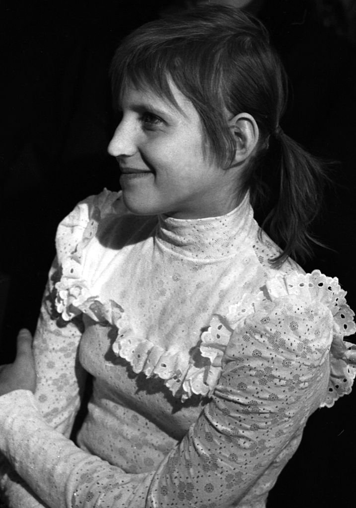 Olga and the white blouse- 1970s fashion realness- okay she's really cute here ngl- is this the taste of success, thru that smile?