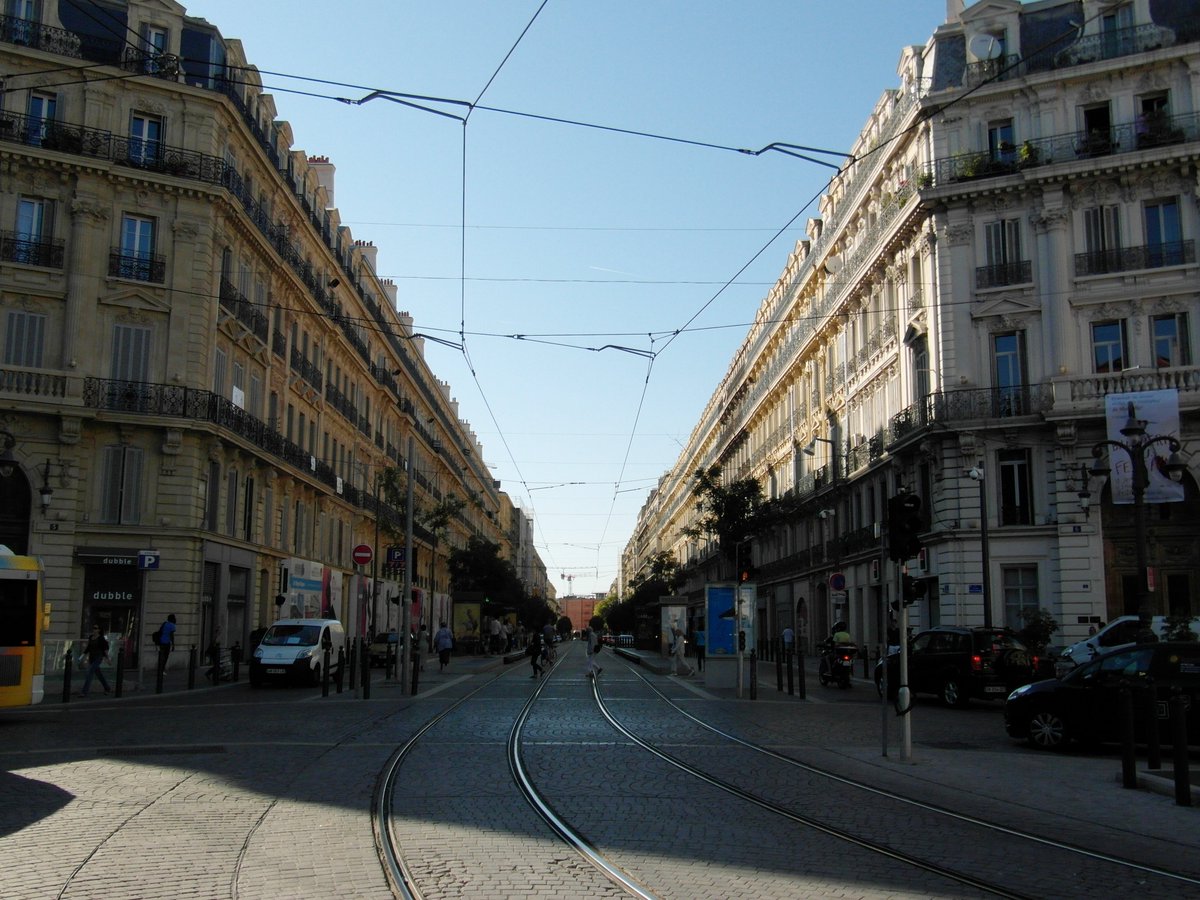 Much like in Haussmann's Paris, this involved tearing through the existing social fabric to build a cleaner, more beautiful and more easily controlled city.The Rue impériale (now rue de la République) was carved between the old and new port to facilitate circulation