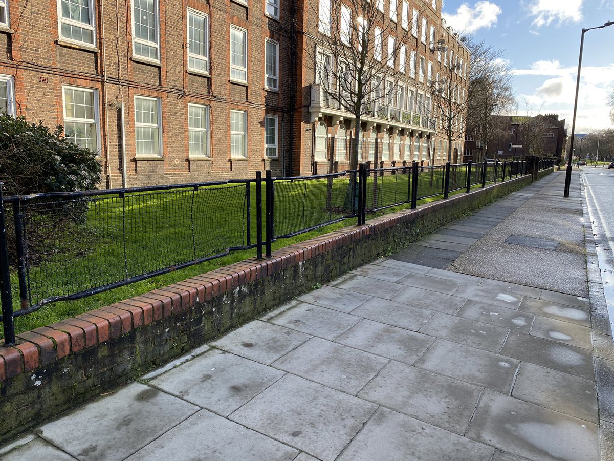 As often found on London’s housing estates, these fences are made from WW2 Air Raid Protection stretchers. 600,000+ stretchers were made for civilian use in the Blitz; but surplus after the war. Estates’ railings had gone for War Effort: stretchers were recycled to replace them.