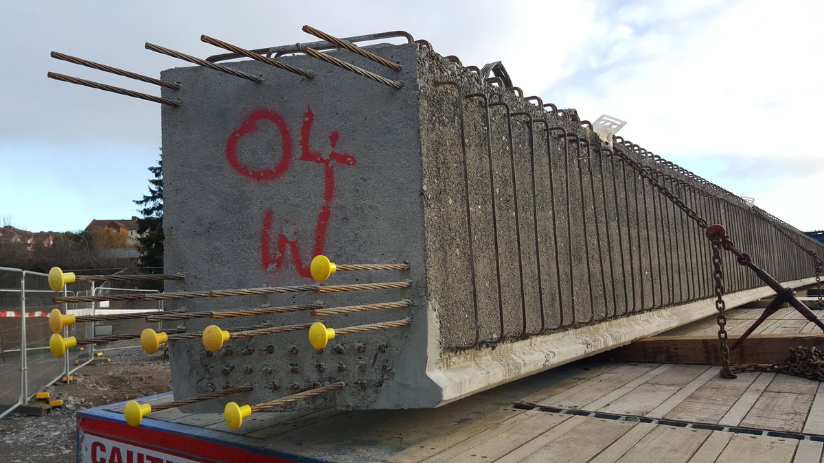 Concrete beams can be pretensioned for better strength. Steel wires are stretched through the beam mould, putting them under strain. The concrete is poured and once cured, the strands are released. The strands are sticking out the end of the beam in these pictures.