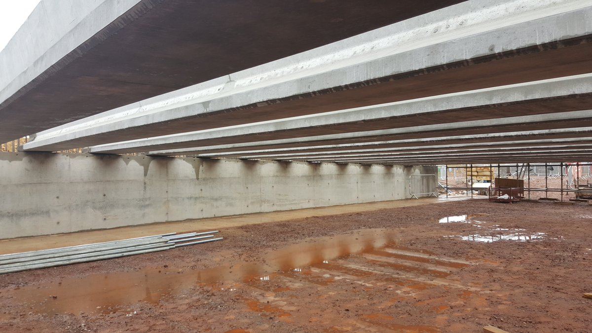 Beams can be adjacent or have a wider spacing. The soffit to stitch slab in the gaps between beams can be formed from plywood on scaffolding, or nowadays precast panels are fitted into place.