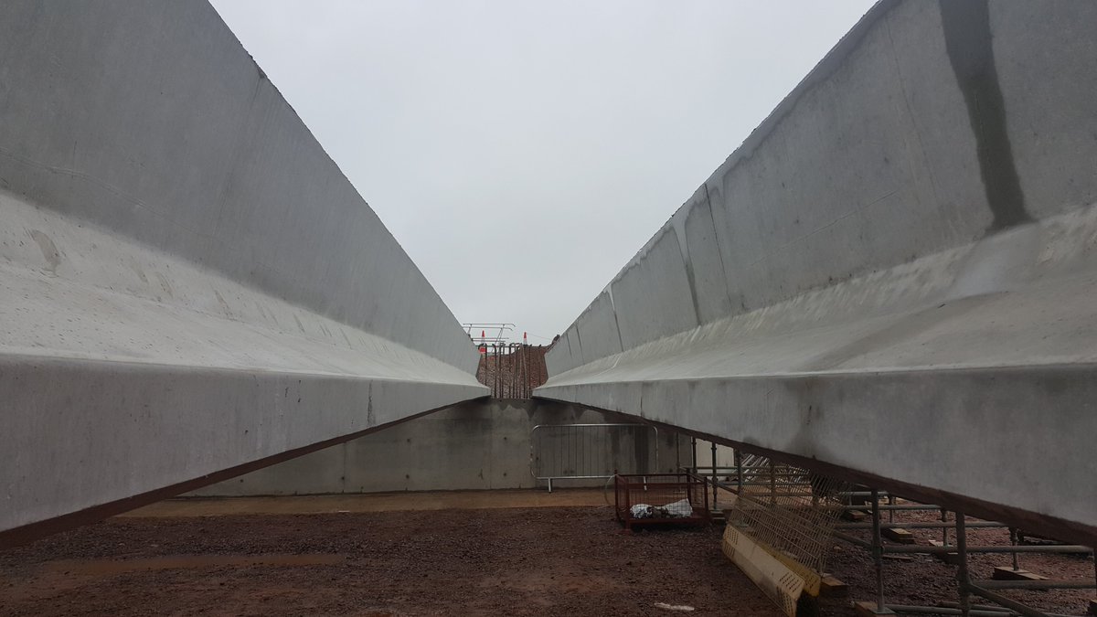 Beams can be adjacent or have a wider spacing. The soffit to stitch slab in the gaps between beams can be formed from plywood on scaffolding, or nowadays precast panels are fitted into place.