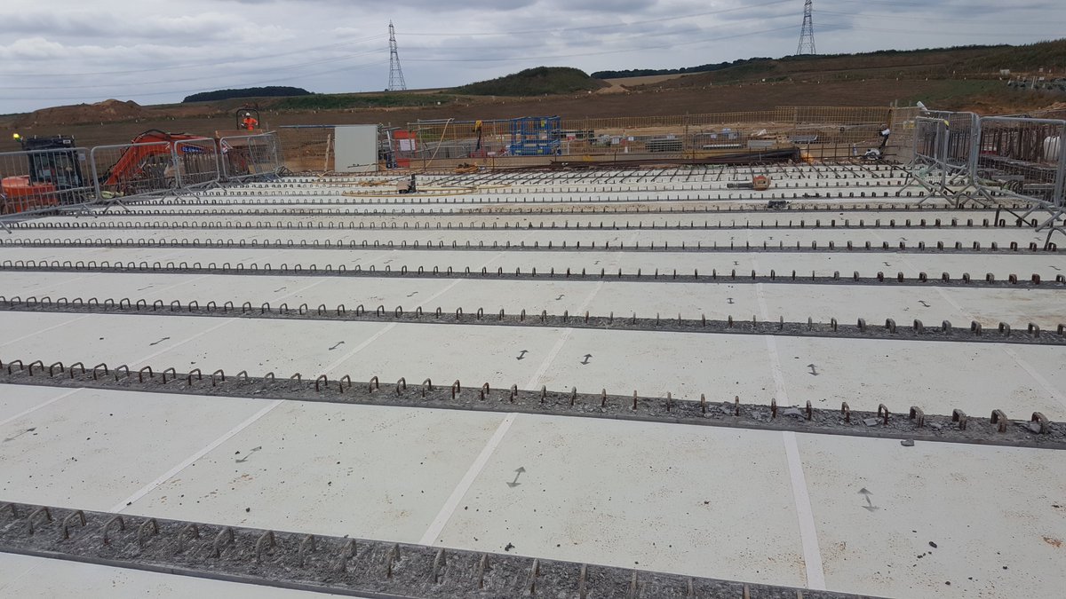 These precast panels can be made from glass-reinforced plastic; some come with steel ribs in for extra strength. They span between beams closing the gap, the concrete is poured on top and they are left in place.