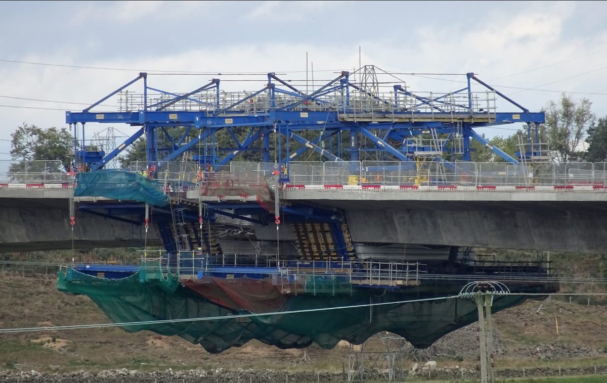 You pour a section, and move the formwork forwards. Cast the next section, move it again. The viaducts on the Aberdeen peripheral route were built using this method. Some major suspension bridges also cast their decks like this. The blue structures is the moving formwork: