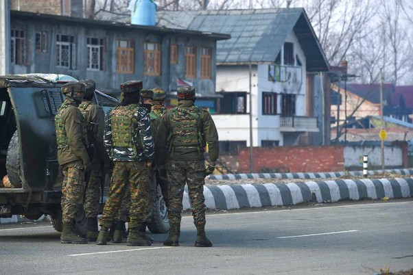 #SRINAGAR | Security personnel stand near the house where militants were hiding during an encounter at Lawaypora on the outskirts of Srinagar. Three militants were killed in the encounter.