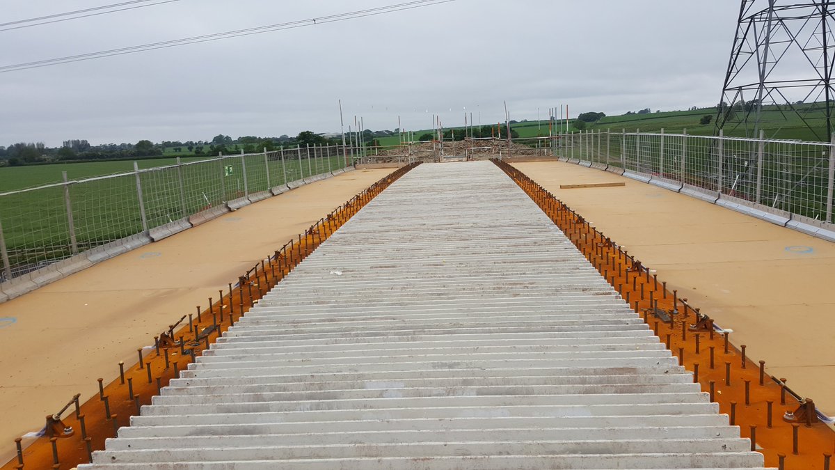 The studs sticking out of steel beams, and rebar hoops in precast beams, are known as shear studs & shear links, they key the concrete to the beam, similar to the fuzzy bits of velcro straps!