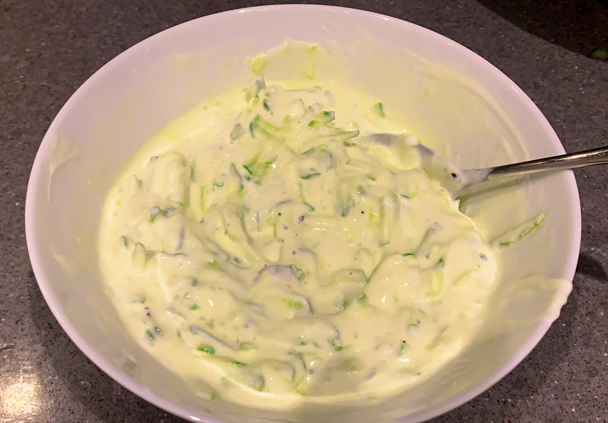  Step 12:Normally for this I would rice the cucumber into small bits but because my kids will eat it better I’m going to grate the cucumberI would also normally finely chop mint but I don’t have any Grab a tub of yoghurt too. Mix it all together. Add salt. Refrigerate