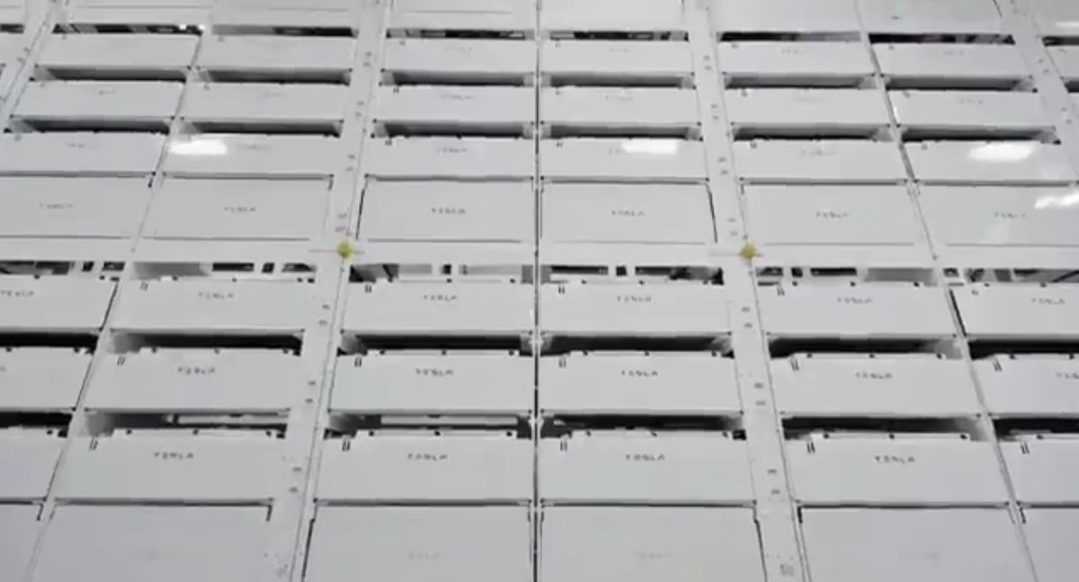 8/This large "wall" of Tesla labeled units appears to be high volume storage for 64-cell racks - possibly QA testing and initial formation (charging) of the cell.Cell formation is usually done by third party equipment - but Tesla clearly uses their own equipment now.